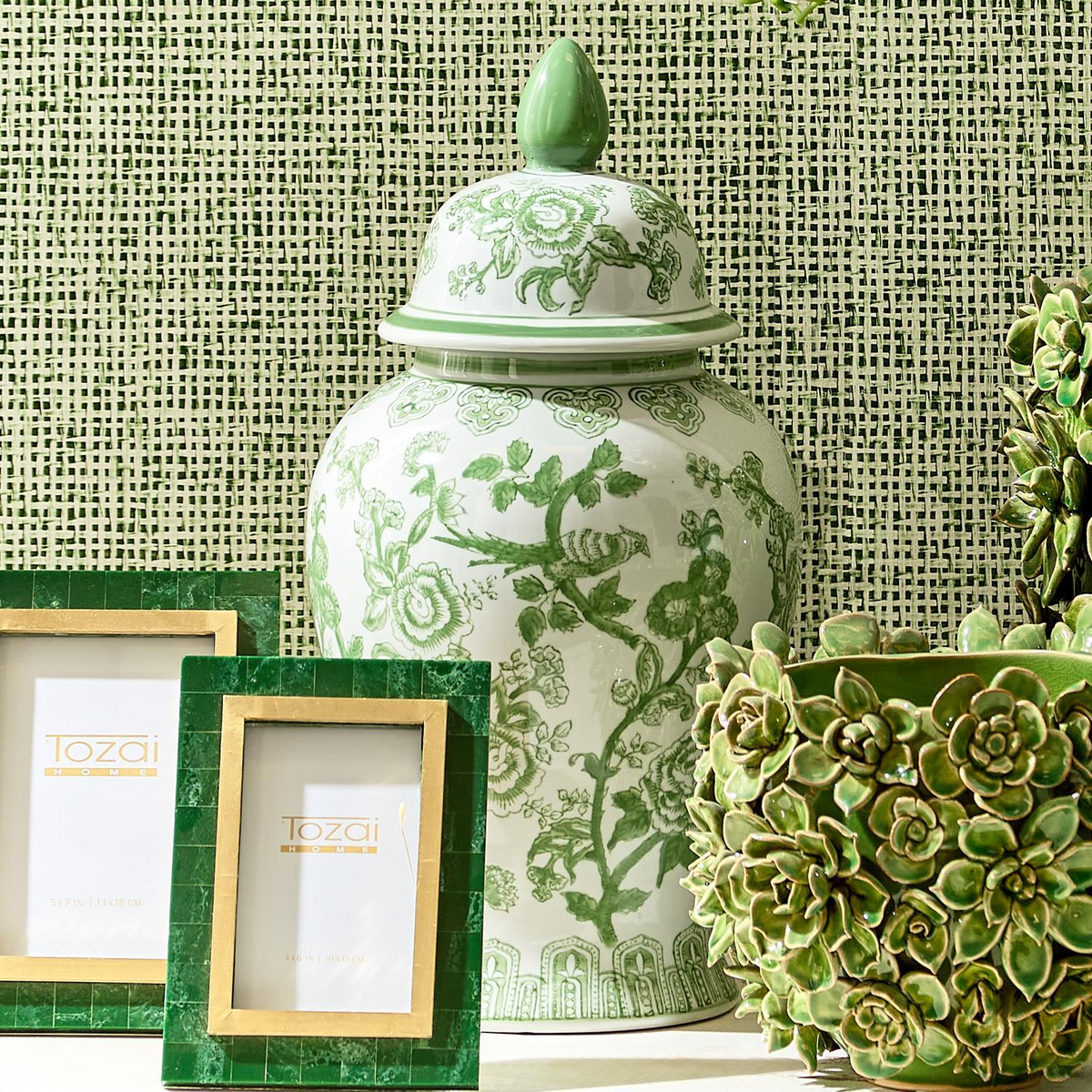18-inch hand-painted green and white porcelain temple jar with floral and bird motifs.