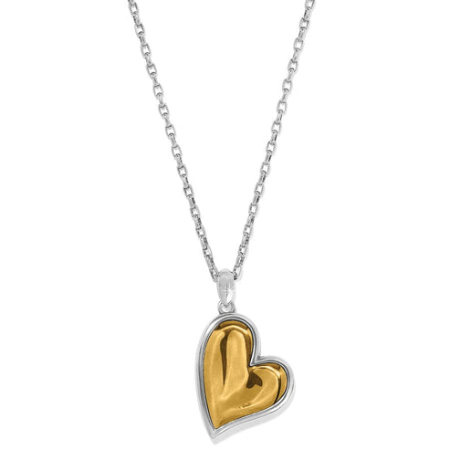 Cascade Heart Necklace with a two-tone silver and gold plated heart pendant on a silver chain.