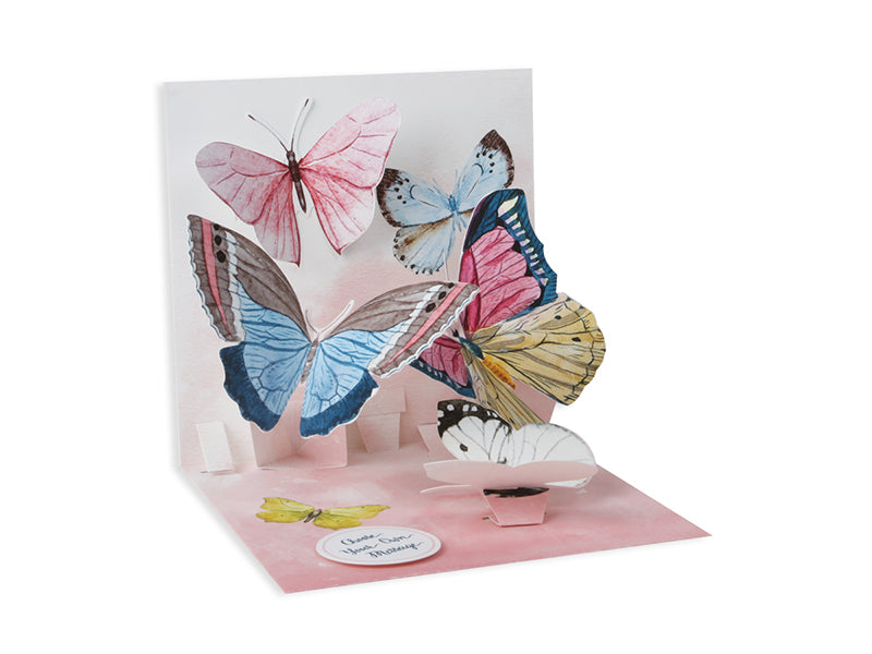 White envelope with gold foil butterflies on a watercolor background.