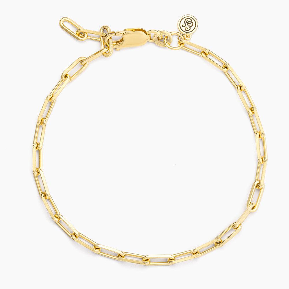 Mini paper clip chain bracelet in silver metal with a lobster clasp closure.