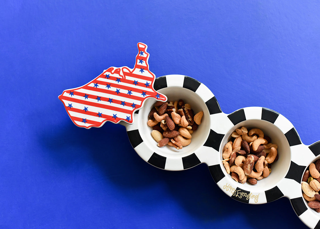 Ceramic mini attachment shaped like the United States with red outline and blue star background.