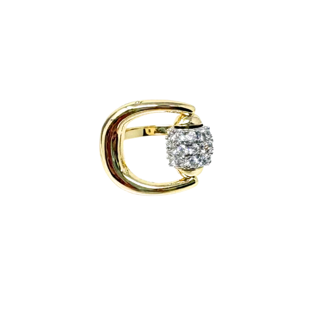 A gold statement ring featuring a thick, curved band and a central barrel encrusted with diamonds.