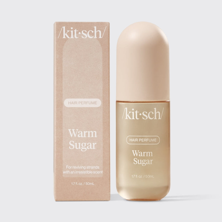 Kitsch Warm Sugar Hair Perfume in a 1.7 fl oz bottle next to its matching cardboard box.