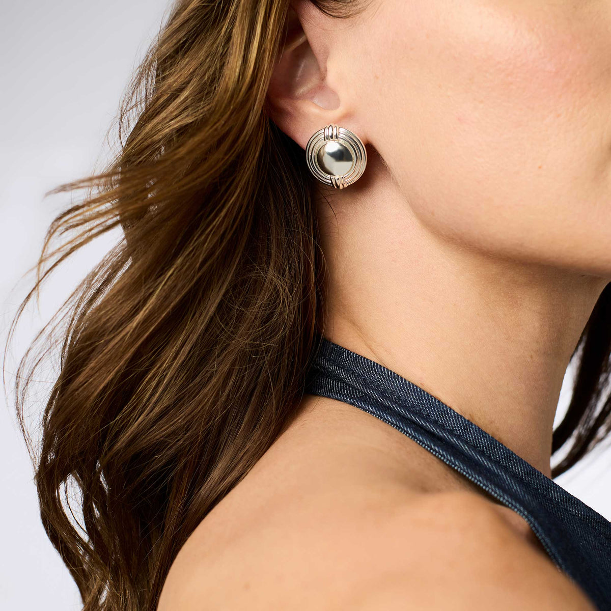Portofino Statement Stud earrings in gold-tone metal with a large round faceted stone.