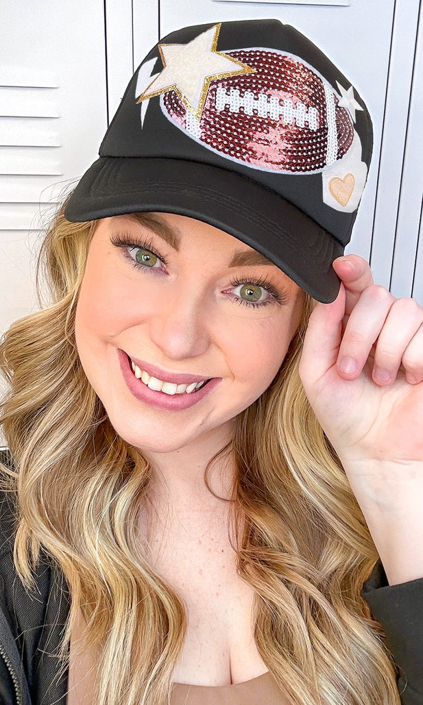Black trucker hat with embroidered football patch on front panel