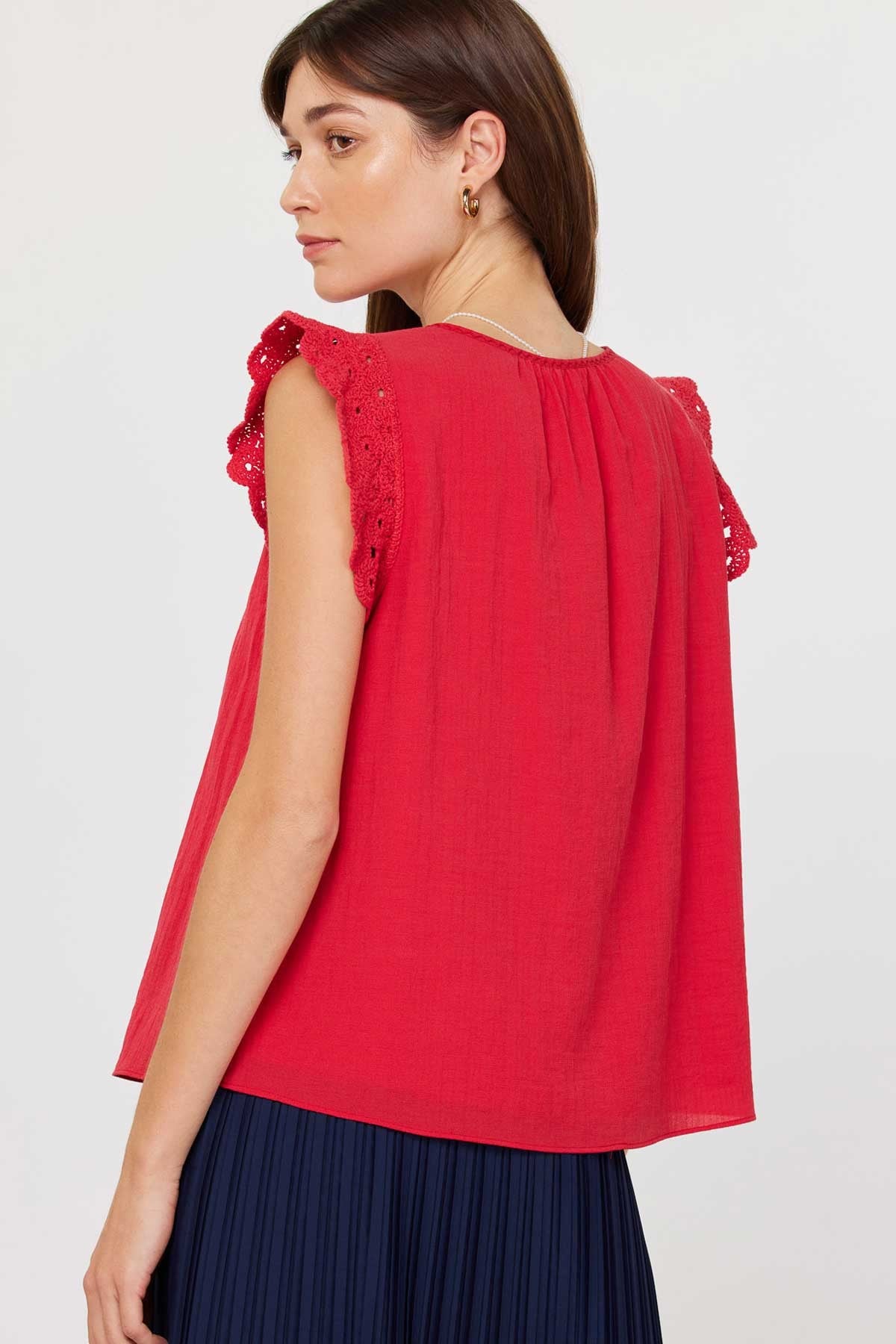 Annie Crochet sleeve blouse in light blue with round neck, front buttons, and keyhole detail.