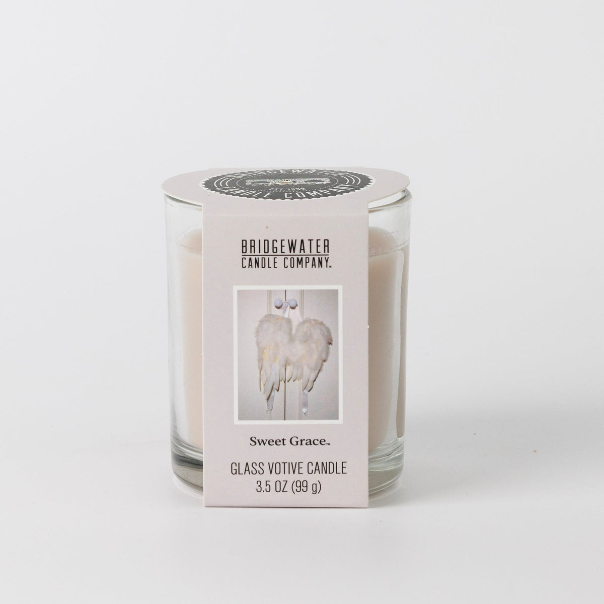 Sweet Grace 3.5 oz glass votive candle by Bridgewater Candle Company with angel wing label.