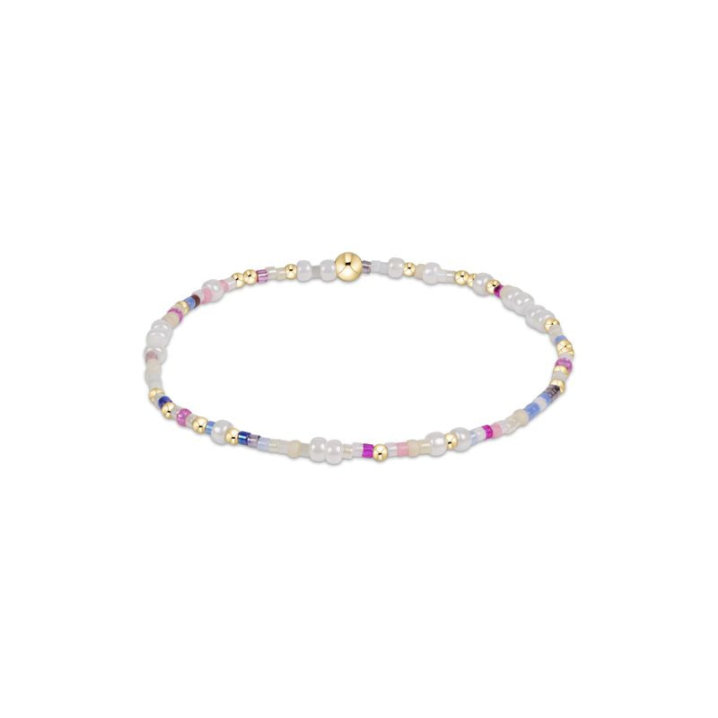 Hope Unwritten bracelet featuring mixed seed beads in various colors with gold-filled accents on elastic cord.