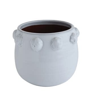 Round terra-cotta planter featuring a raised dot bubble texture pattern.