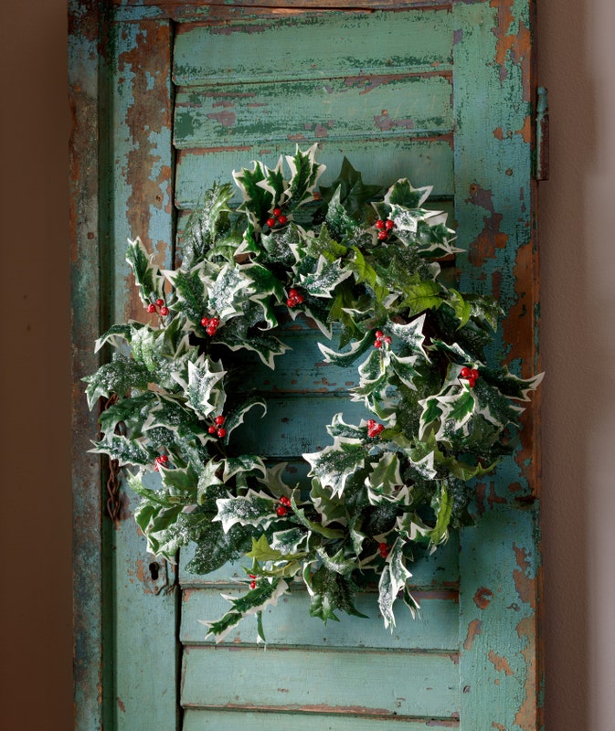 Frosted 24-inch vintage holly wreath with red berries on a rustic teal wooden door.