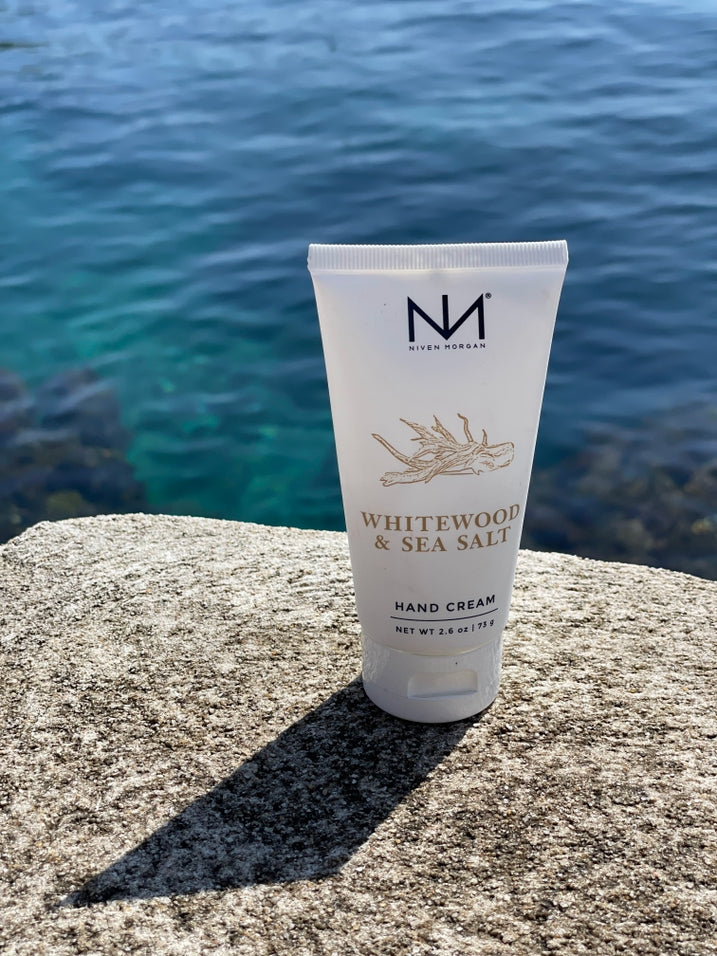 Whitewood & Sea Salt travel hand cream in a white tube with natural botanical illustrations.