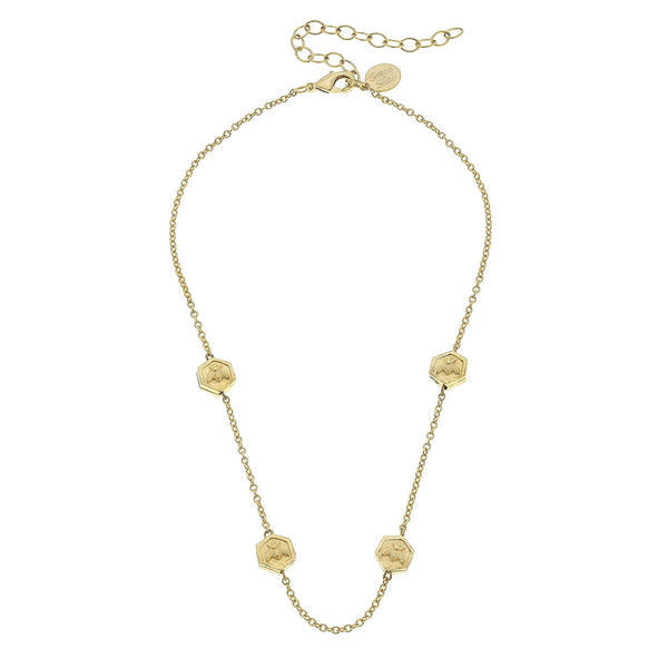 Triple plated gold multi-bee necklace with a dainty chain featuring small bee charms.