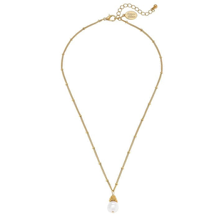 Front view of a dainty freshwater pearl drop necklace on a triple-plated gold chain.