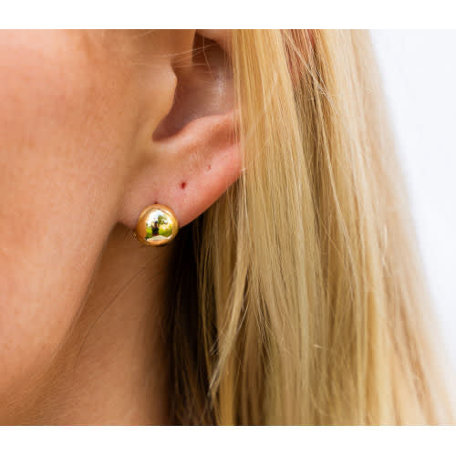 Gold ball huggie hoop earring with a plain circular silhouette.
