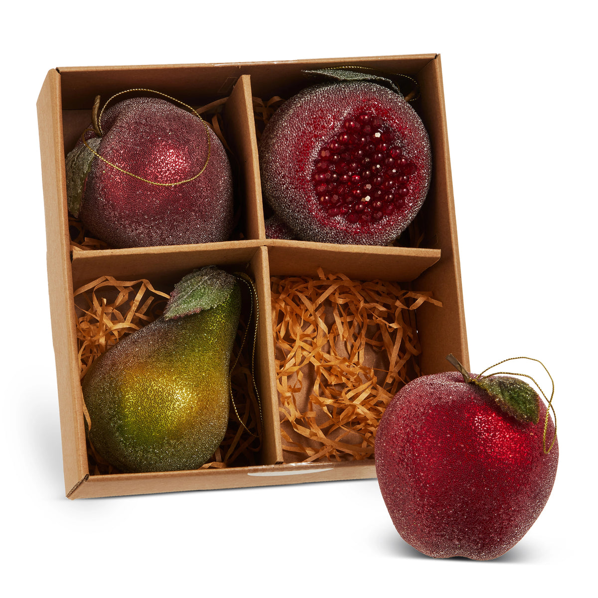 Sugared fruit ornaments in a box, including a red apple, pear, and pomegranate with glitter finish.