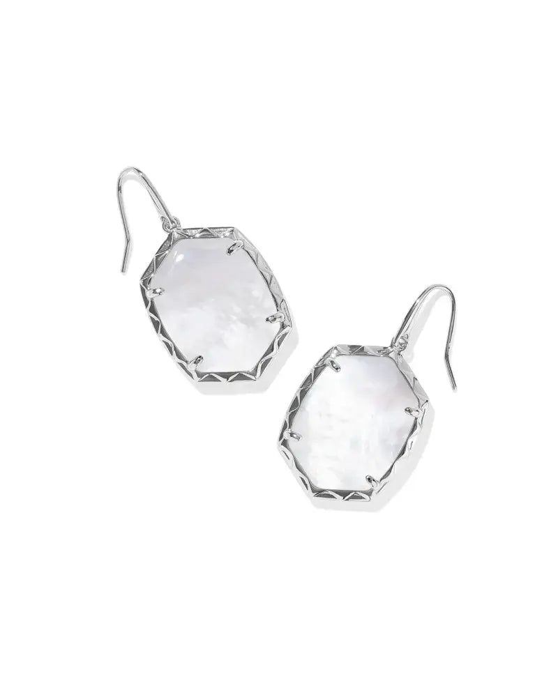 Silver drop earrings with ivory mother-of-pearl accents in a textured frame.
