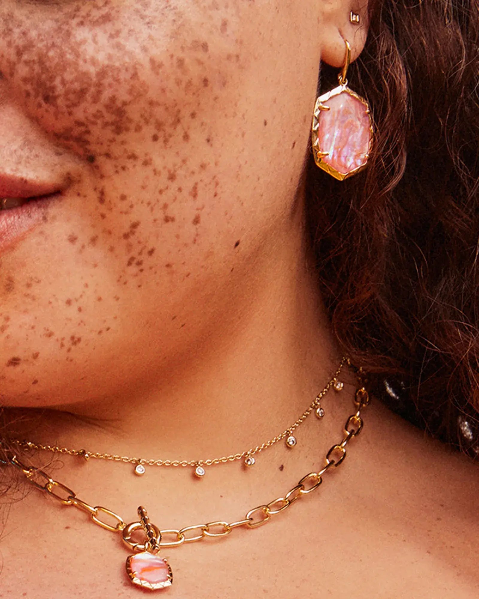Daphne drop earrings with a textured frame in silver-tone metal featuring an oval silhouette.