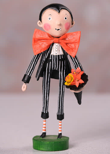 Poly resin figurine of Dracula in a black pinstriped suit with an orange bow tie holding orange flowers.