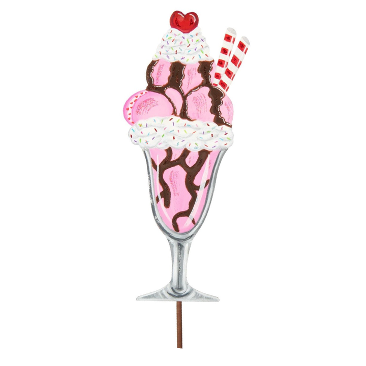 Pink ice cream sundae stake with chocolate drizzle, whipped cream, sprinkles, wafer cookies, and a cherry heart.