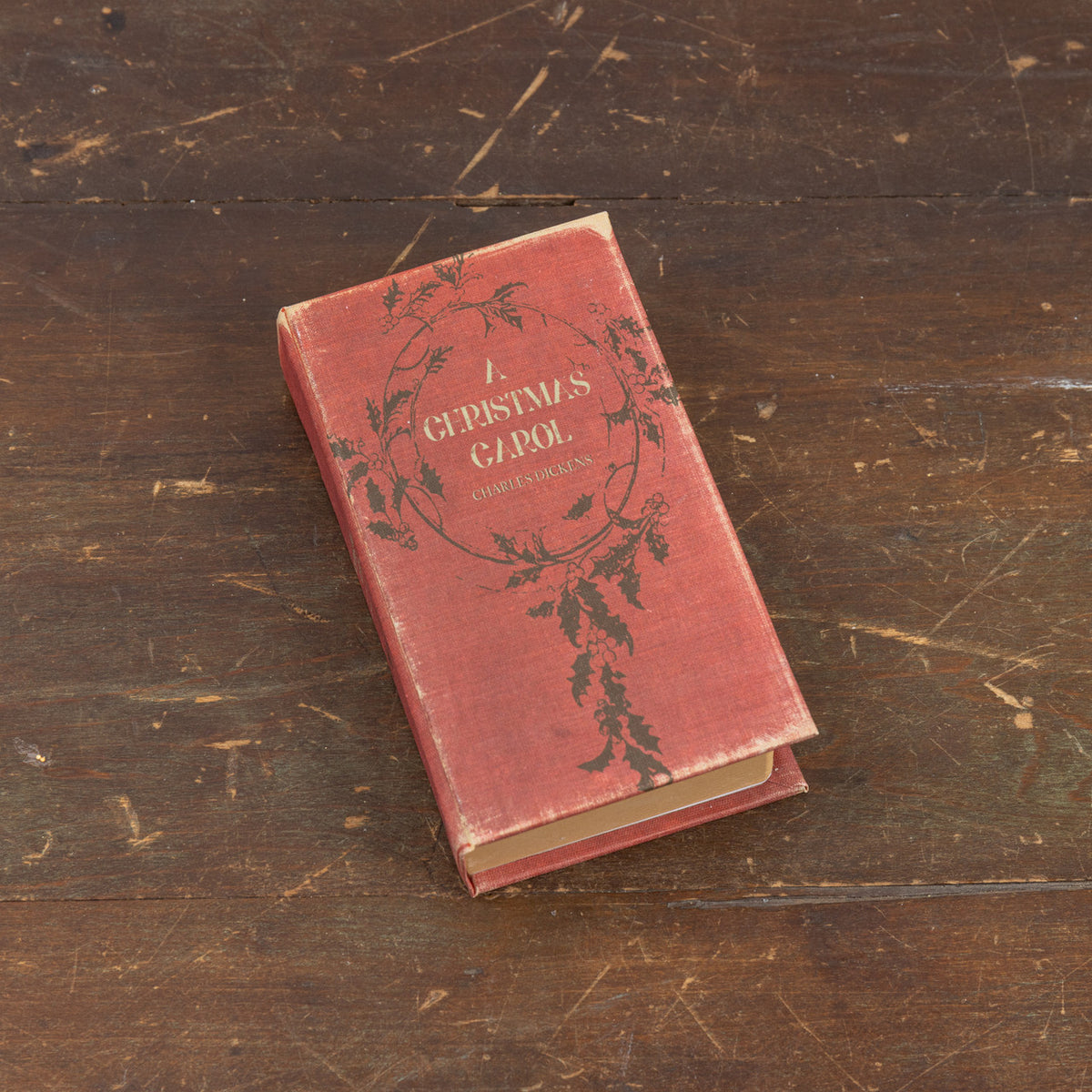 Hardcover journal with wood cover featuring a festive Christmas Carol theme.