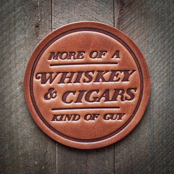 Square leather coaster with a natural patina finish.