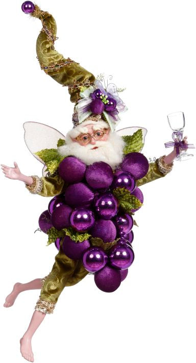A 16.5-inch Grape Fairy figurine wearing a green velvet outfit and holding a wine glass.