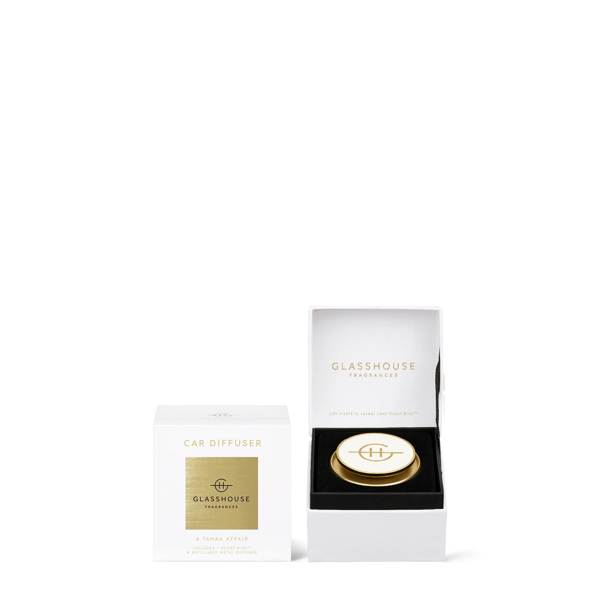 A Tahaa Affair Car Diffuser set with a white box and a gold and white metal diffuser.