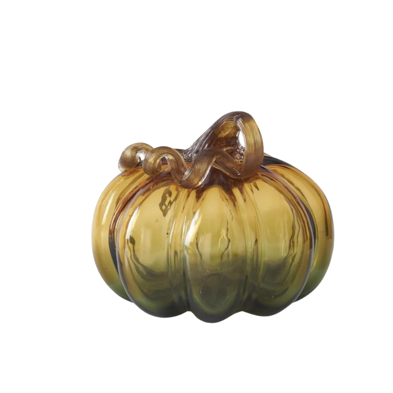Green and amber handblown glass pumpkin with a curled brown stem.