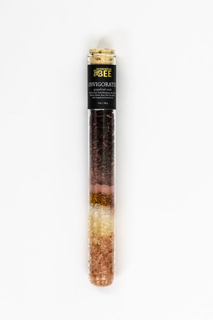 Generation Bee Invigorated Grapefruit Soak in a glass test tube vial with cork stopper.