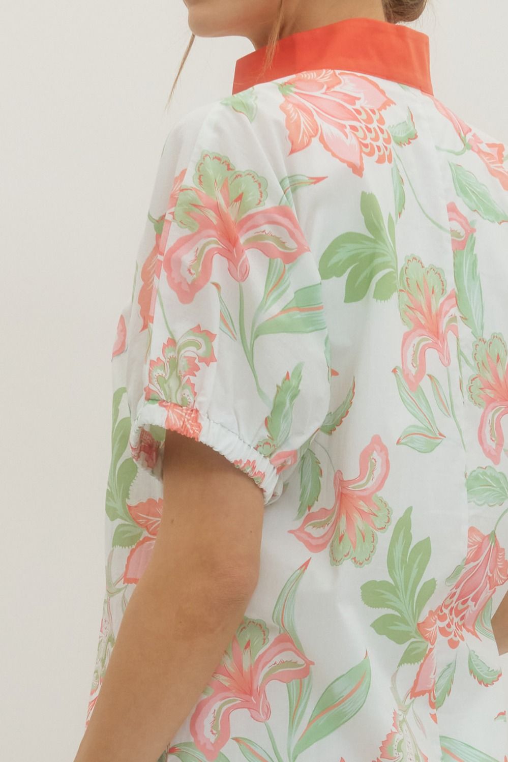 Ella floral print mini dress with puff sleeves, contrast band collar V-neck, and side pockets in lightweight cotton.