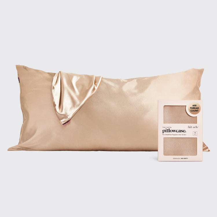 Satin pillowcase in a soft neutral tone with smooth texture.