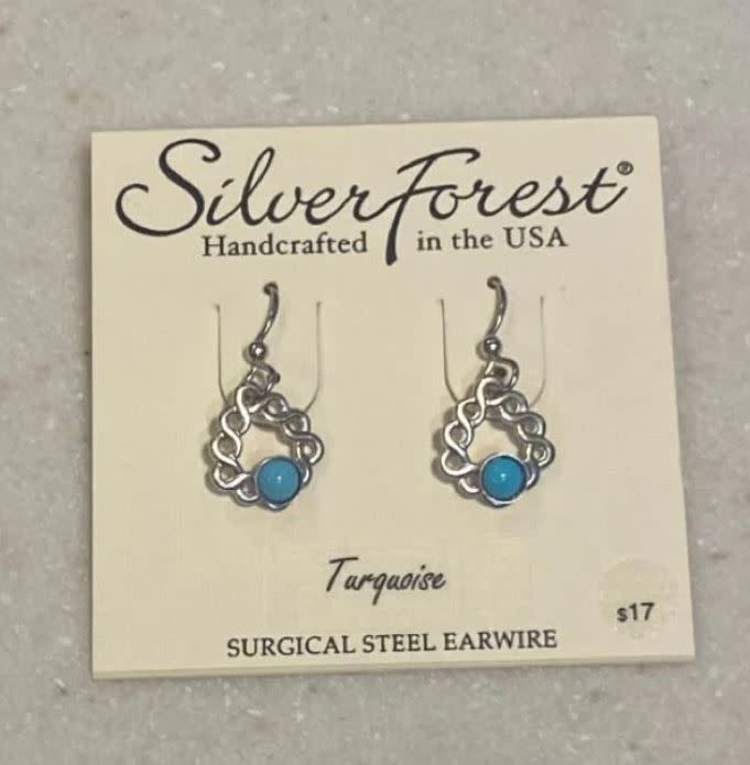 Silver Forest turquoise cabochon earrings with woven silver triangles on surgical steel earwires.