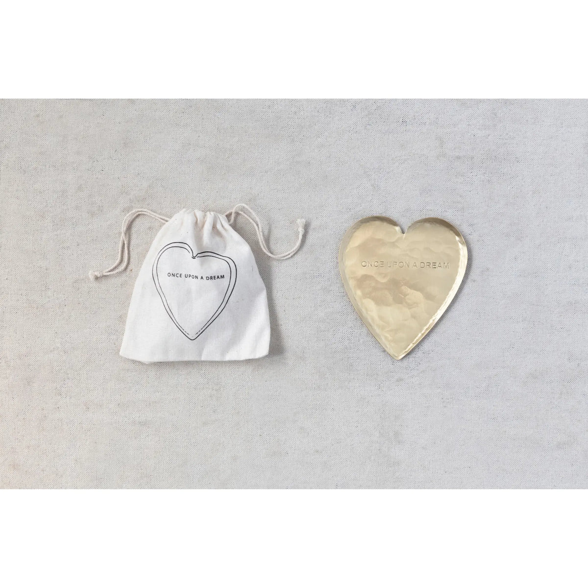 Hammered brass heart-shaped dish with carved 'once upon a dream' text