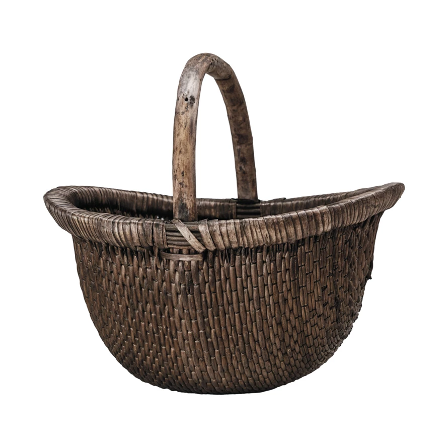 Oval antique finish wicker basket made from brown willow wood with a vintage hand-woven texture.