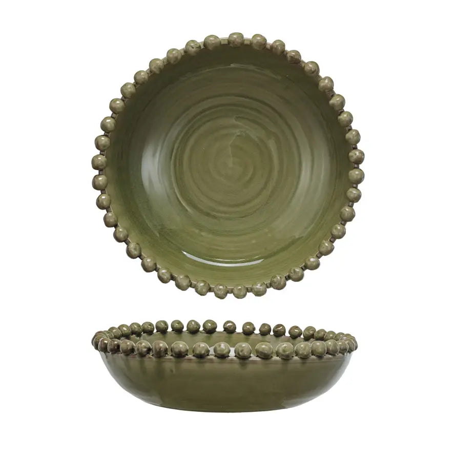 Round handmade terra-cotta bowl with reactive glaze finish and hobnail edge detail
