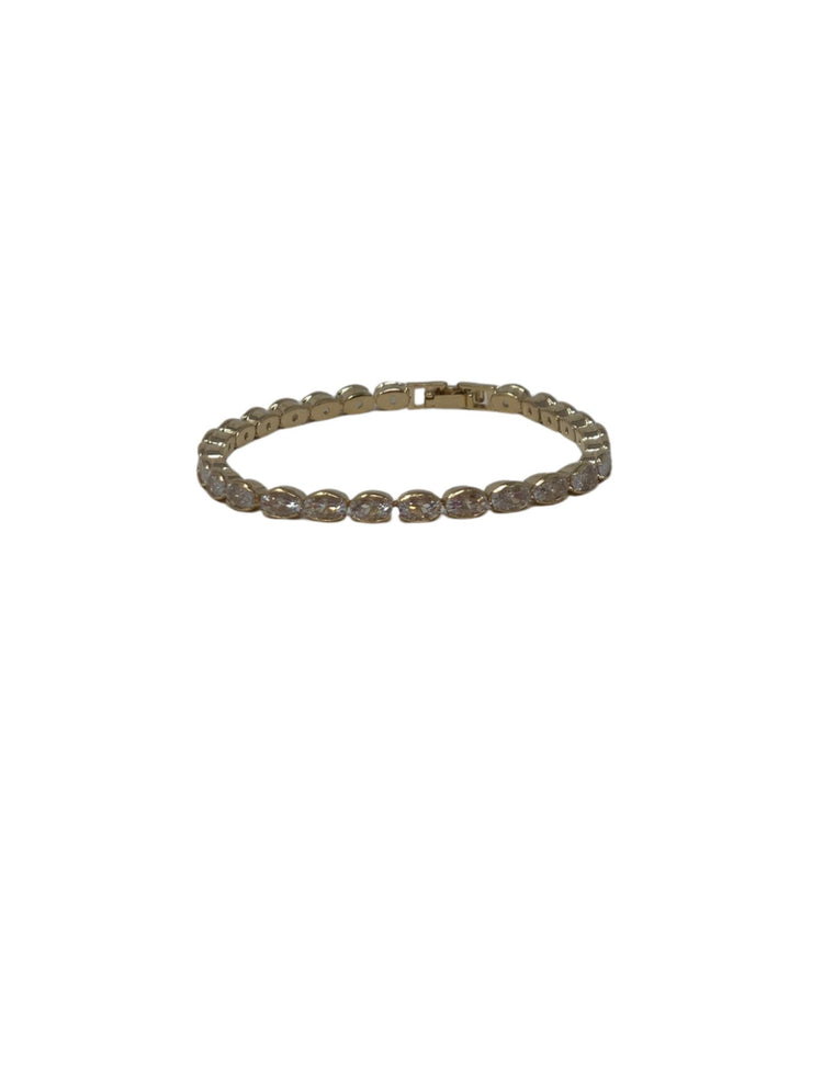 Gold bracelet featuring a continuous row of oval-cut crystals with a secure clasp closure.