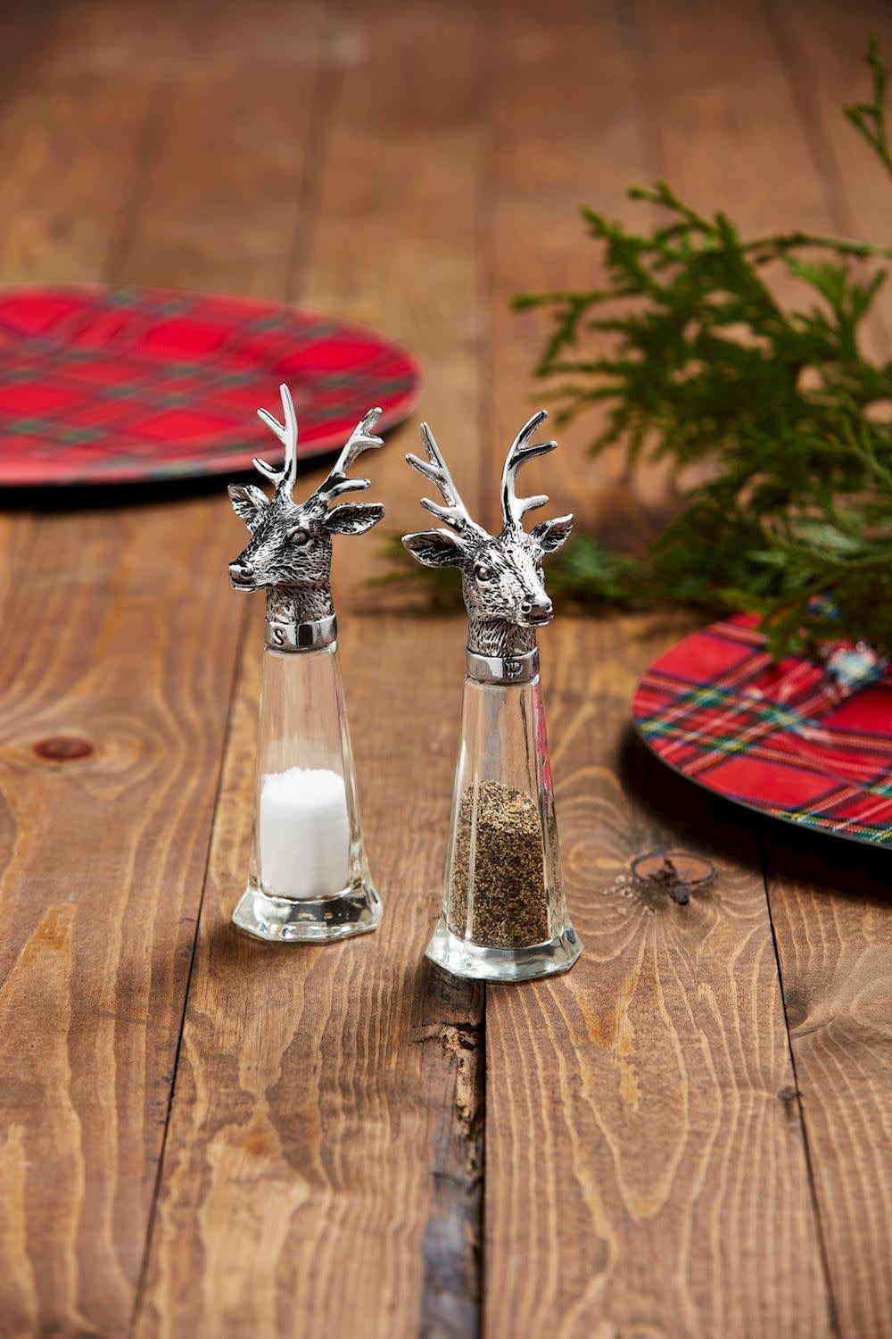 Glass salt and pepper shakers with cast aluminum deer toppers