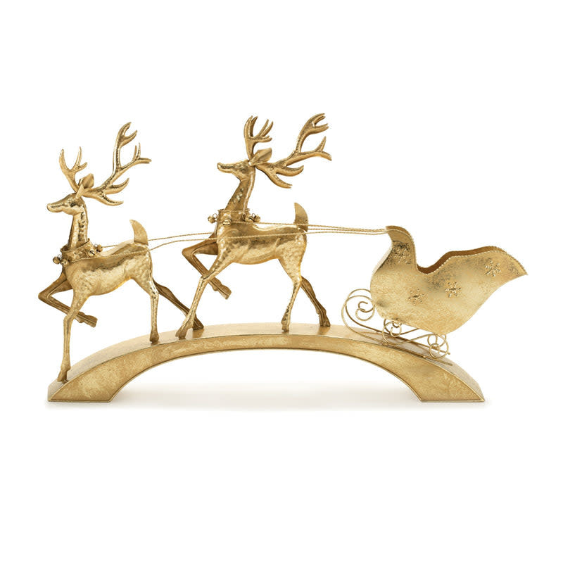 Iron holiday decoration featuring a deer pulling a sleigh.