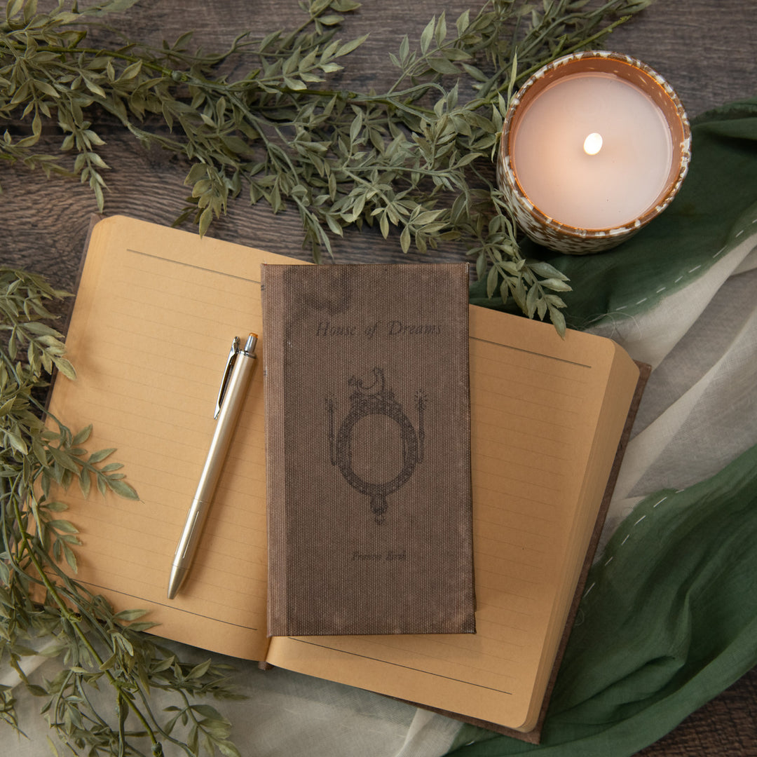 7-inch House of Dreams journal with wood cover featuring a dreamy illustration.