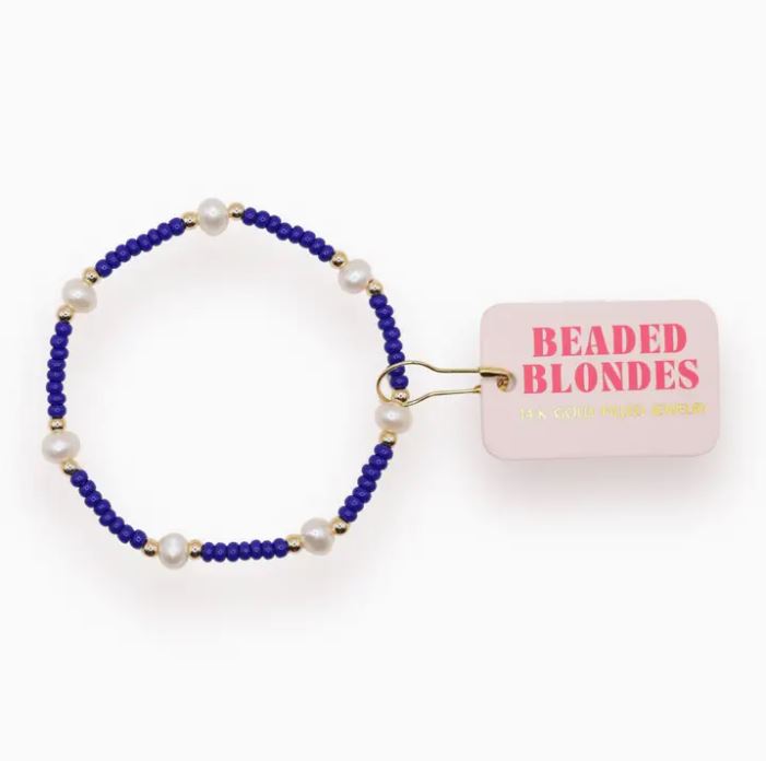 Elastic pearl bracelet with synthetic pearls on a gold-filled cord.