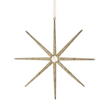 Champagne-colored star-shaped ornament with intricate Southwestern patterns.