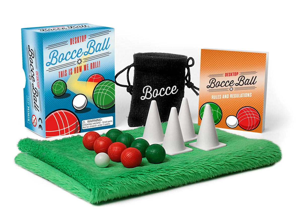 Desktop bocce ball set with four dark green balls, four red balls, a white pallino, felt mat, and cones.