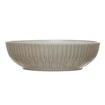 White debossed stoneware bowl with a round shape