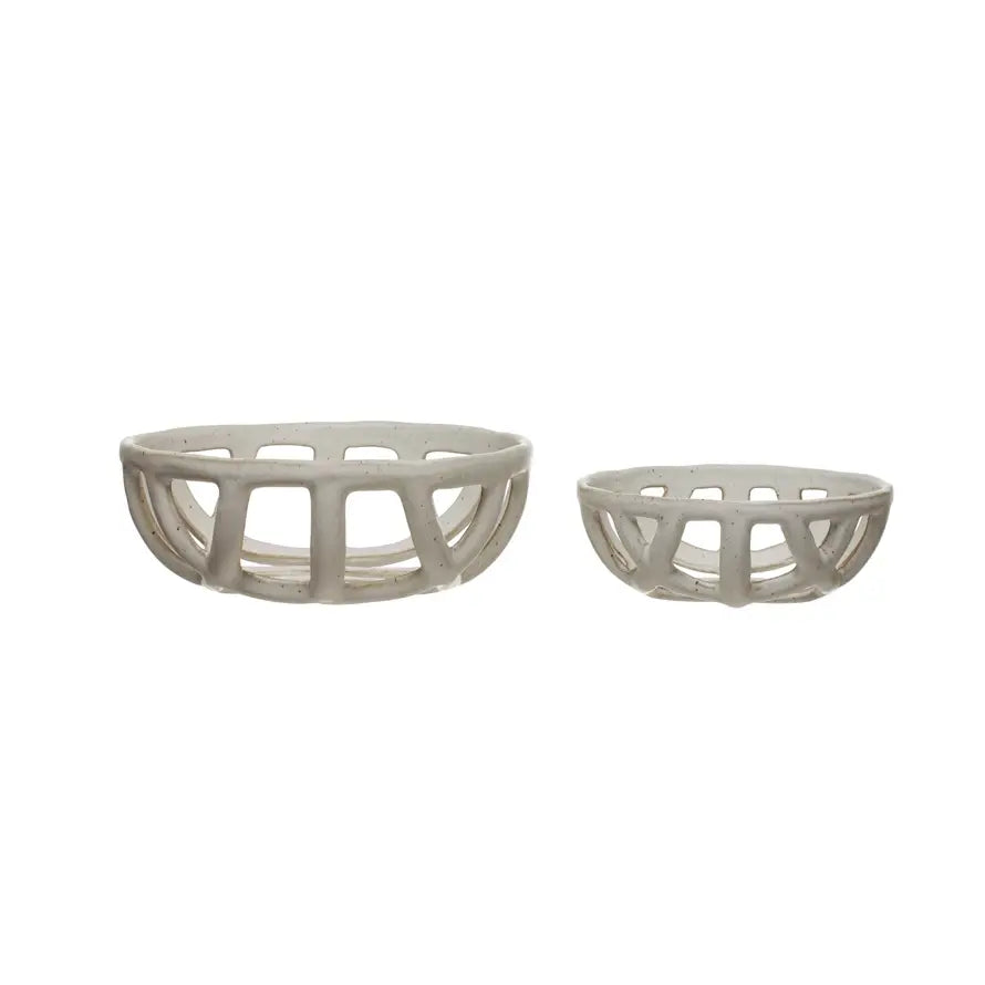 Two round handmade stoneware basket bowls with white reactive glaze finish.