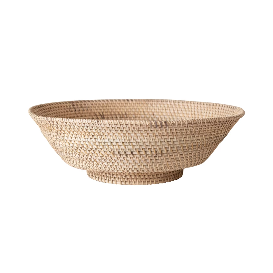 Round footed bowl made from natural woven rattan with an organic finish.