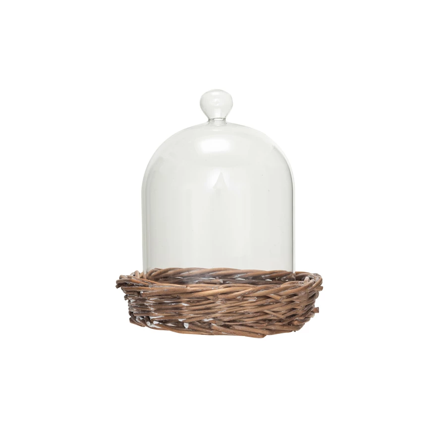 Round clear glass cloche dome on a natural woven willow base
