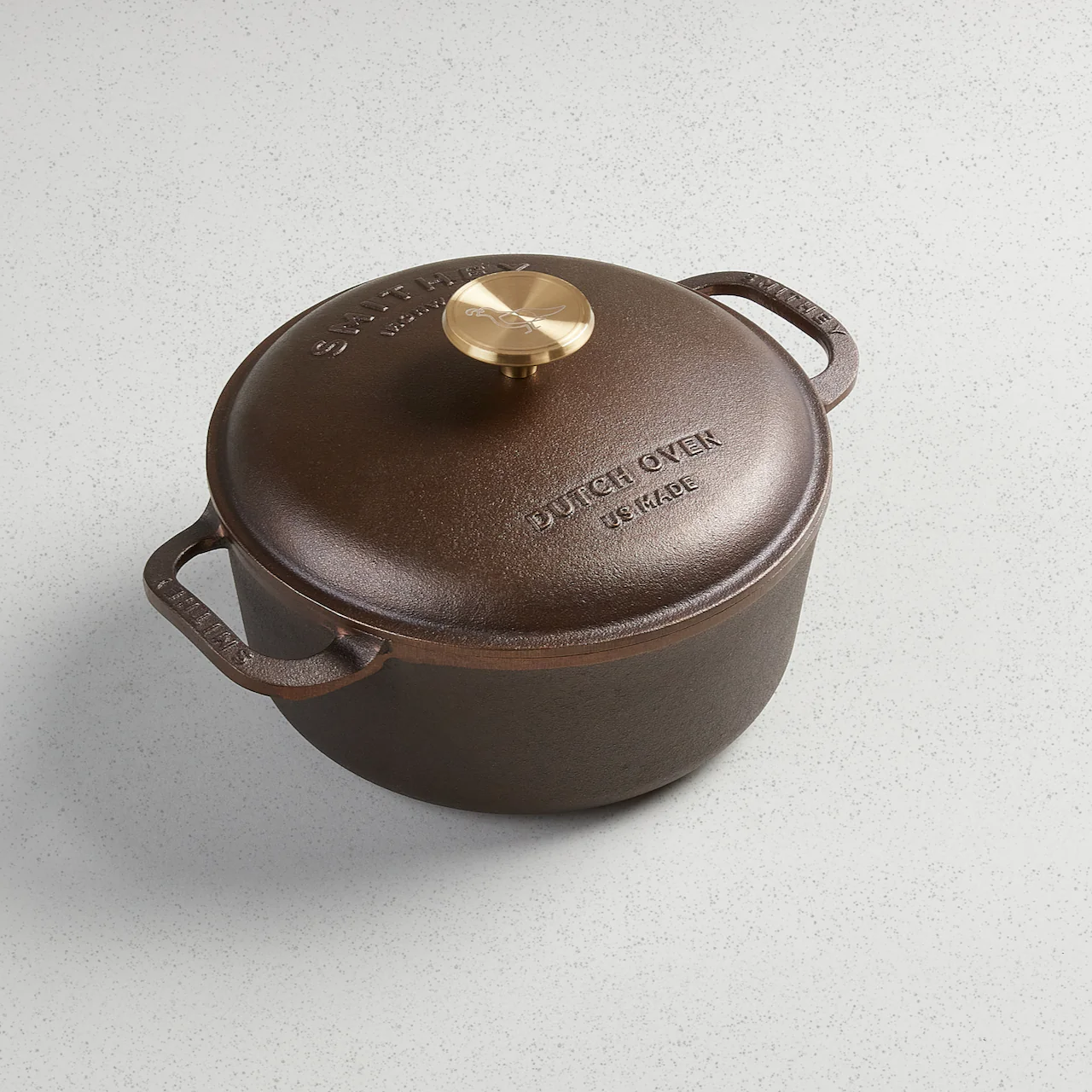 3.5 Qt cast iron Dutch Oven with a polished interior, brass knob, and side handles.
