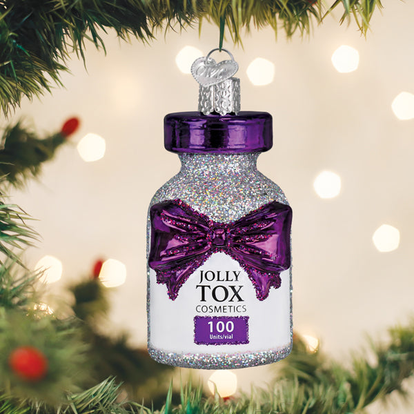 Jolly Tox Ornament: a small festive bottle-shaped decoration with holiday-themed labeling.