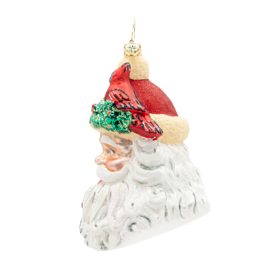 Woodland Wishes Santa glass ornament featuring a red cardinal on a holly-trimmed hat.