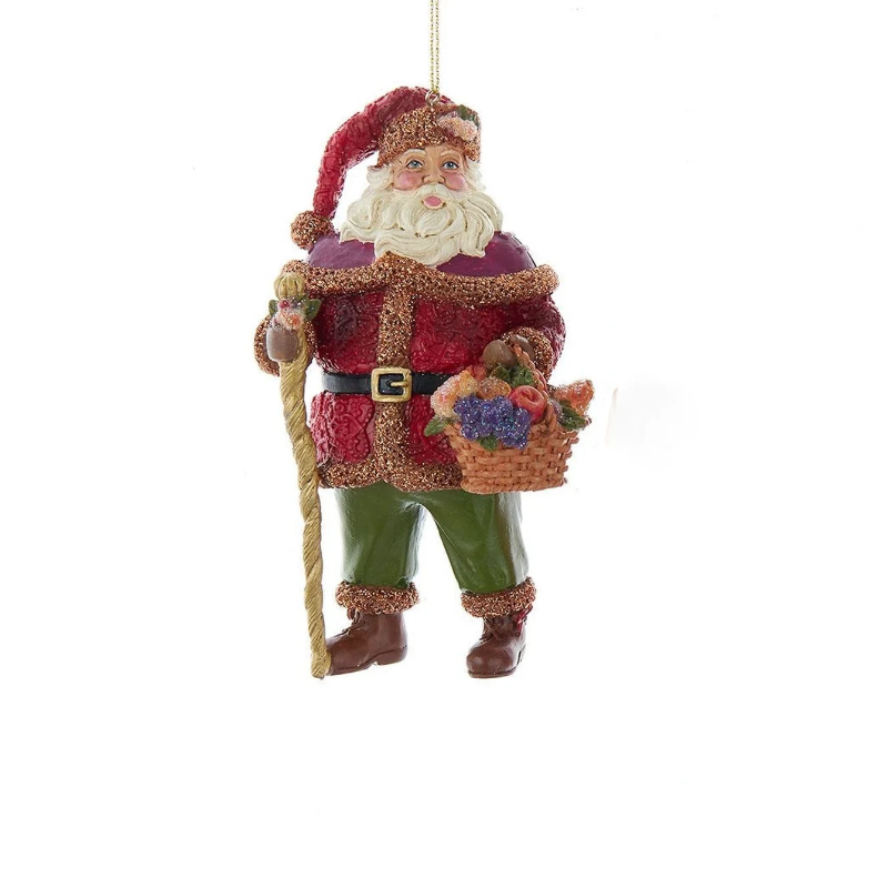 Sugar Frost Santa ornament in a red coat and green pants holding a staff and fruit basket.
